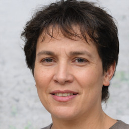 Joyful white adult female with short  brown hair and brown eyes