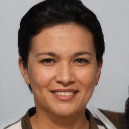 Joyful white adult female with short  brown hair and brown eyes