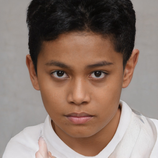 Neutral latino child male with short  brown hair and brown eyes