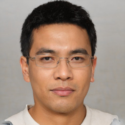 Neutral asian young-adult male with short  brown hair and brown eyes