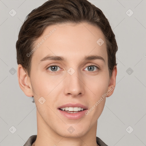 Joyful white young-adult male with short  brown hair and grey eyes