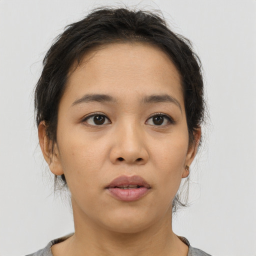 Neutral asian young-adult female with medium  brown hair and brown eyes
