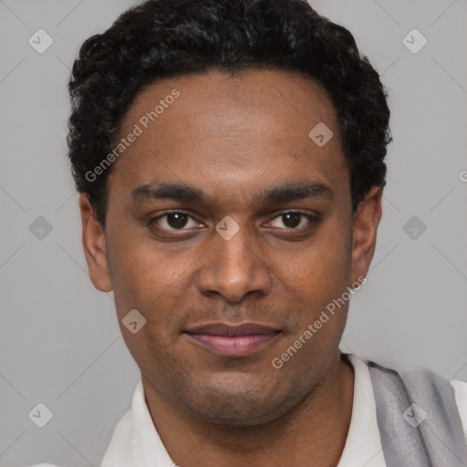 Joyful black young-adult male with short  black hair and brown eyes