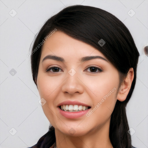 Joyful white young-adult female with long  black hair and brown eyes