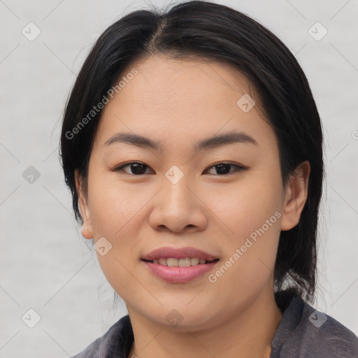 Joyful asian young-adult female with medium  brown hair and brown eyes