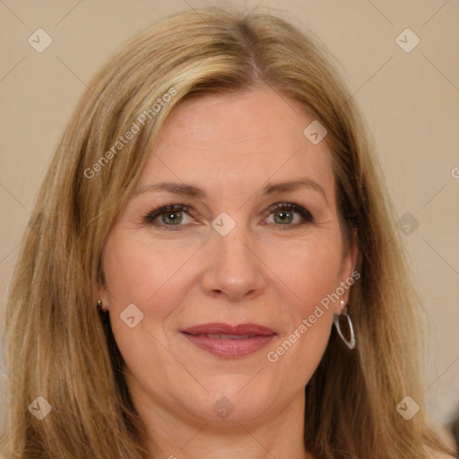 Joyful white adult female with long  brown hair and brown eyes