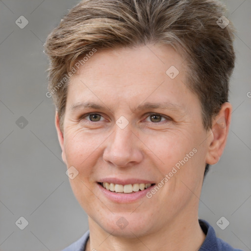 Joyful white adult female with short  brown hair and brown eyes