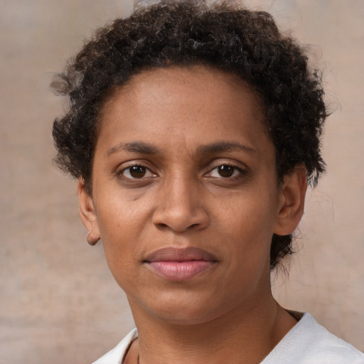 Neutral black adult female with short  brown hair and brown eyes