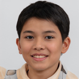 Joyful white child male with short  brown hair and brown eyes