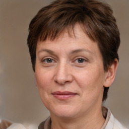 Joyful white adult female with short  brown hair and brown eyes