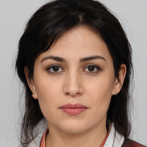 Neutral white young-adult female with medium  brown hair and brown eyes