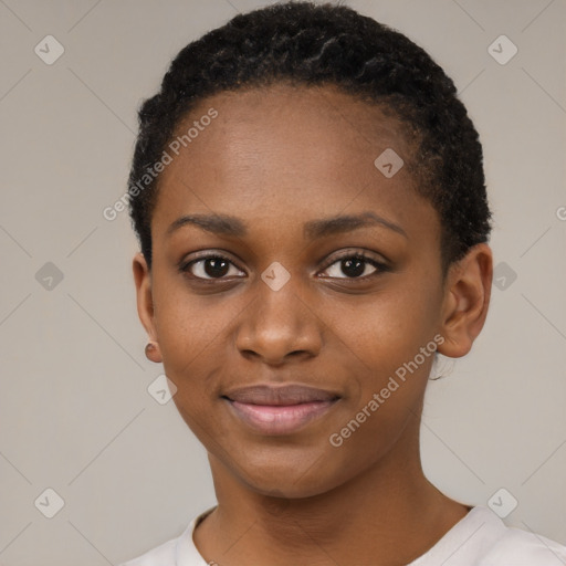 Joyful black young-adult female with short  black hair and brown eyes