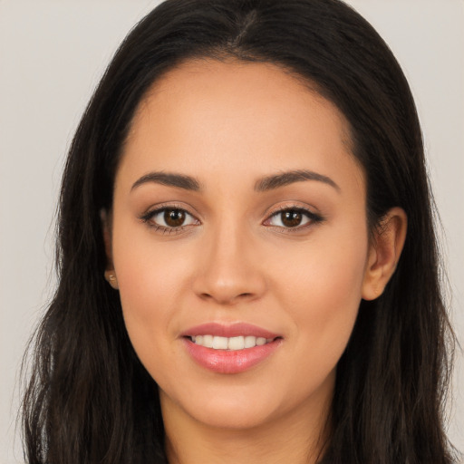 Joyful white young-adult female with long  black hair and brown eyes