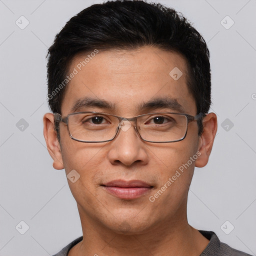 Joyful white adult male with short  black hair and brown eyes