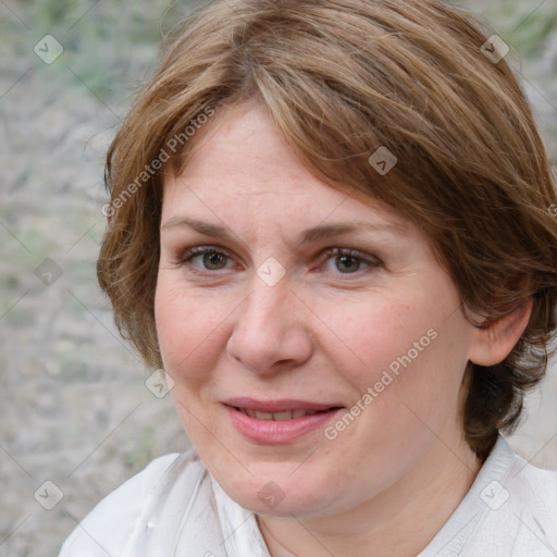 Joyful white adult female with medium  brown hair and brown eyes