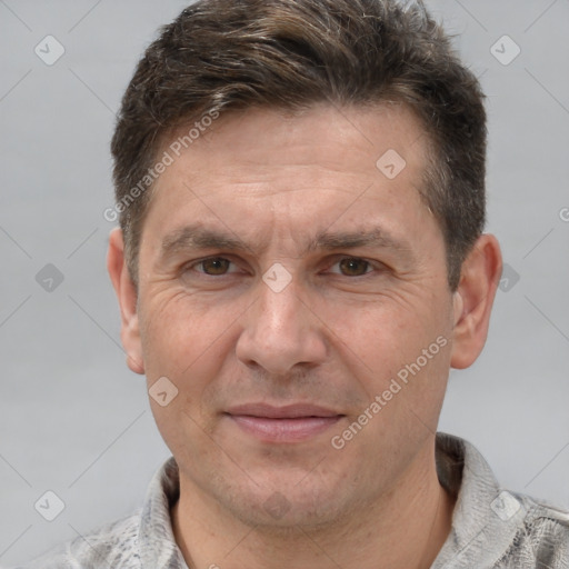 Joyful white adult male with short  brown hair and grey eyes