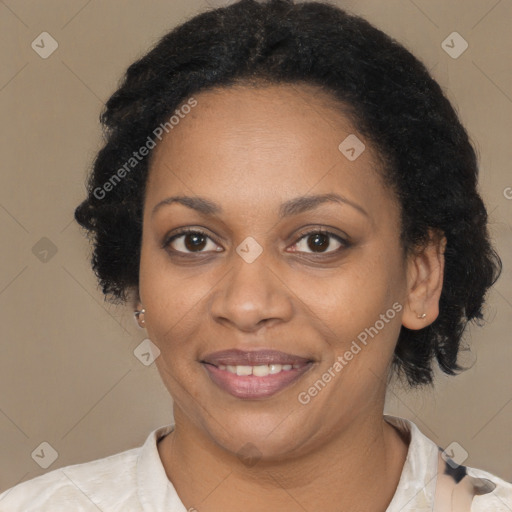 Joyful black adult female with medium  brown hair and brown eyes
