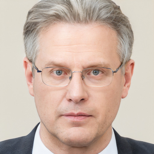Neutral white middle-aged male with short  gray hair and blue eyes