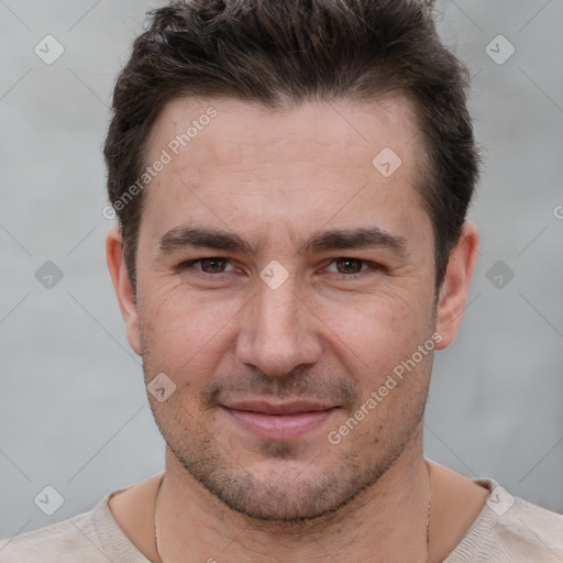 Joyful white adult male with short  brown hair and brown eyes