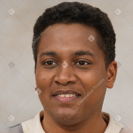 Joyful latino young-adult male with short  brown hair and brown eyes