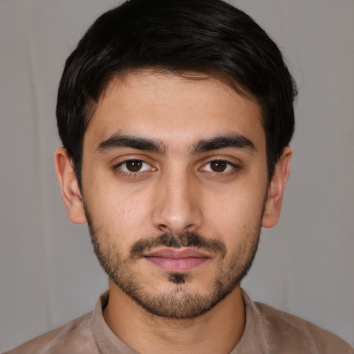 Neutral white young-adult male with short  black hair and brown eyes