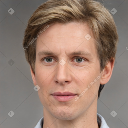 Joyful white adult male with short  brown hair and grey eyes