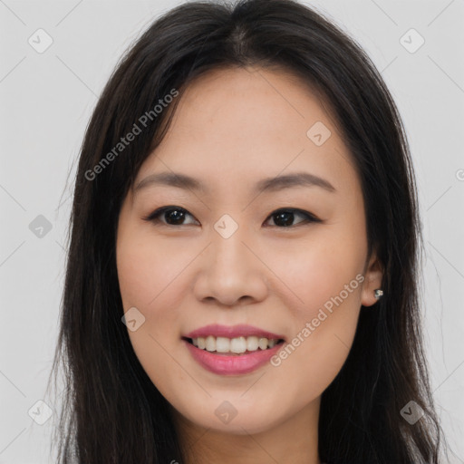 Joyful asian young-adult female with long  brown hair and brown eyes