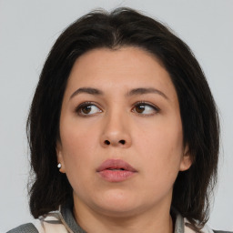 Neutral asian young-adult female with medium  brown hair and brown eyes