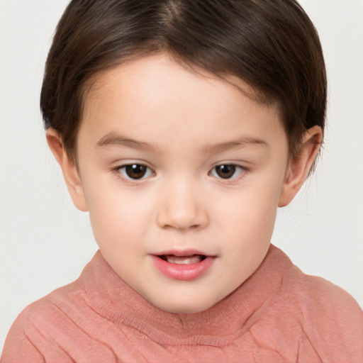 Joyful white child female with short  brown hair and brown eyes