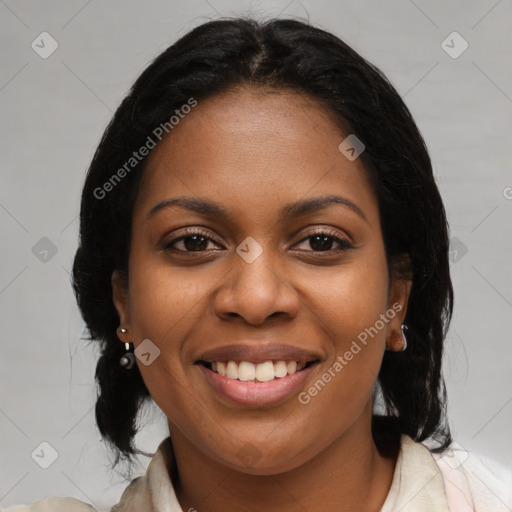 Joyful black young-adult female with medium  brown hair and brown eyes