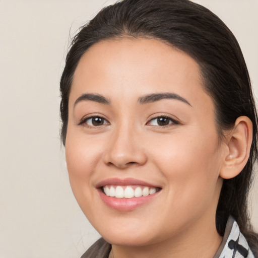 Joyful white young-adult female with medium  brown hair and brown eyes