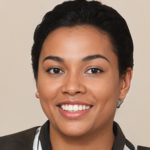 Joyful latino young-adult female with short  black hair and brown eyes