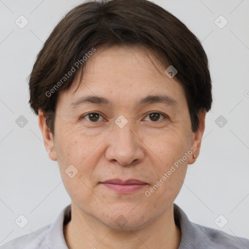 Joyful white adult female with short  brown hair and brown eyes