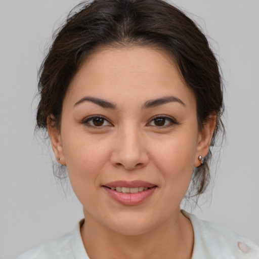 Joyful white young-adult female with medium  brown hair and brown eyes