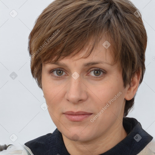 Joyful white adult female with short  brown hair and brown eyes