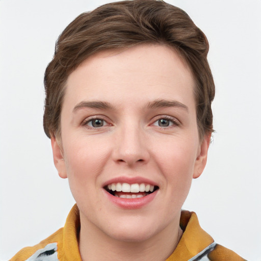 Joyful white young-adult female with short  brown hair and grey eyes