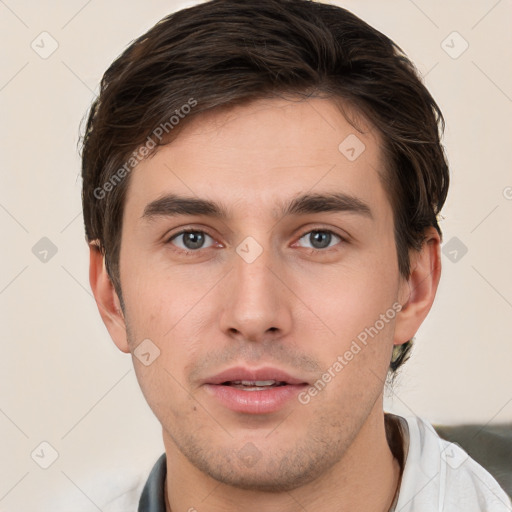 Neutral white young-adult male with short  brown hair and brown eyes