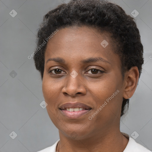 Joyful black young-adult female with short  brown hair and brown eyes