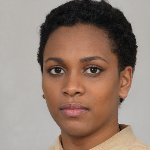 Neutral black young-adult female with short  black hair and brown eyes