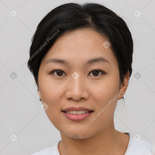 Joyful asian young-adult female with short  black hair and brown eyes