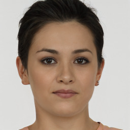 Joyful white young-adult female with short  brown hair and brown eyes