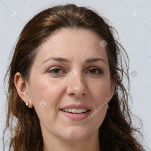 Joyful white adult female with long  brown hair and brown eyes