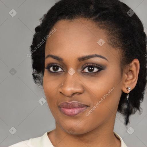 Joyful black young-adult female with medium  black hair and brown eyes