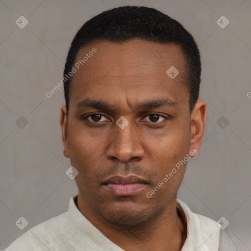 Neutral latino young-adult male with short  black hair and brown eyes