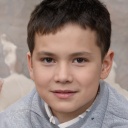 Joyful white child male with short  brown hair and brown eyes