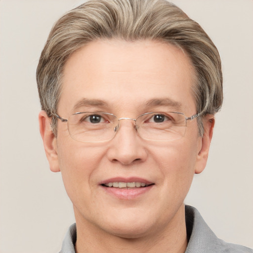 Joyful white adult male with short  brown hair and grey eyes