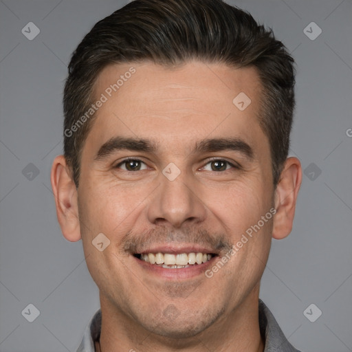 Joyful white adult male with short  brown hair and brown eyes