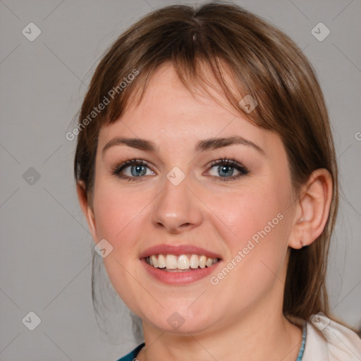 Joyful white young-adult female with medium  brown hair and blue eyes