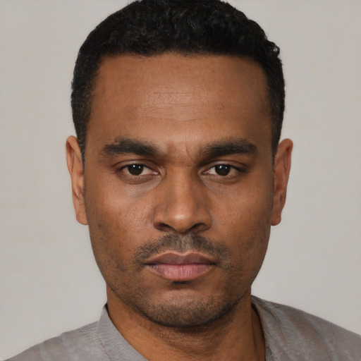 Neutral black young-adult male with short  black hair and brown eyes