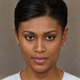 Neutral black young-adult female with short  brown hair and brown eyes